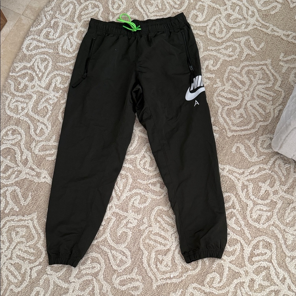 Nike Black Joggers with Green Accents